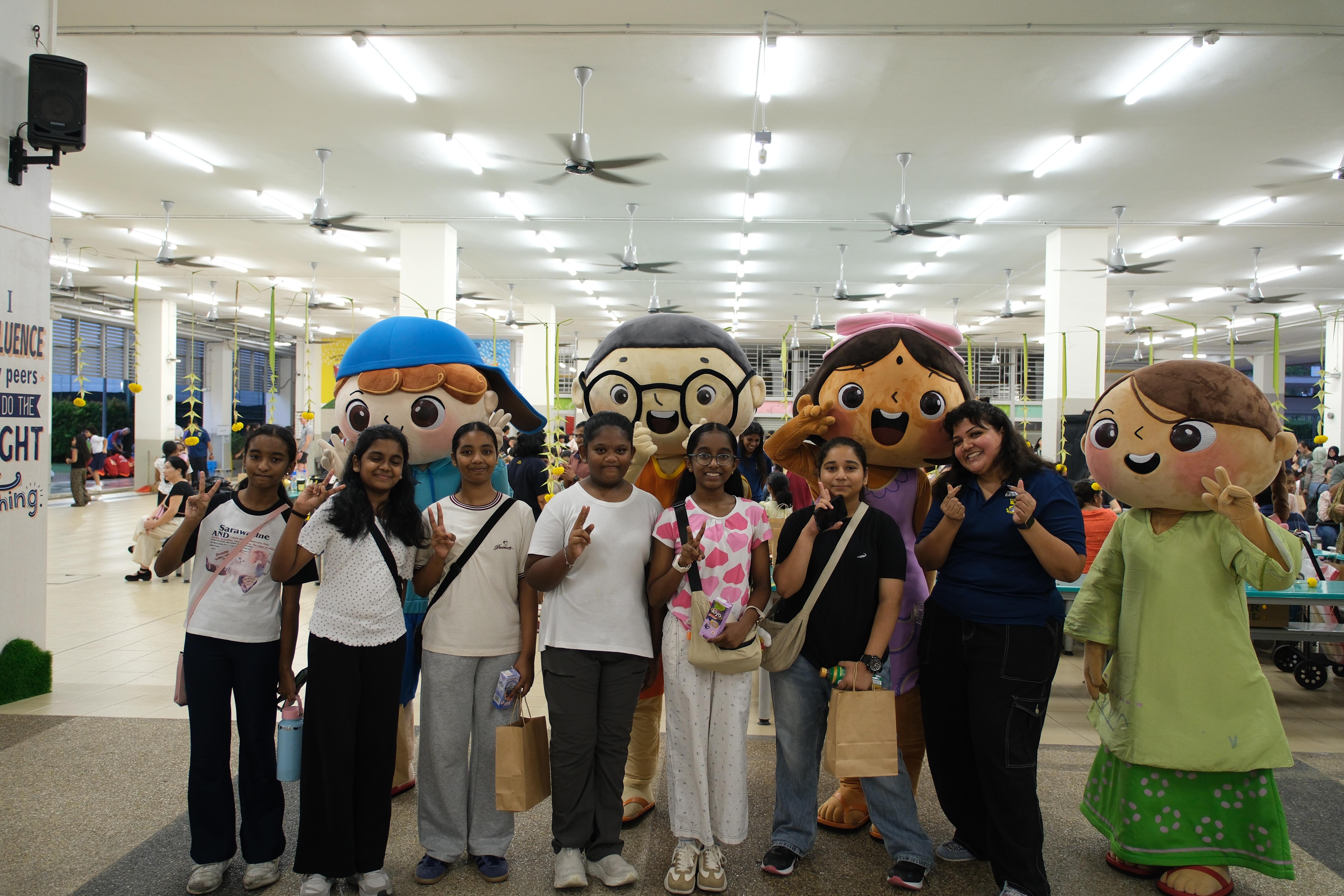 Say cheese with the Chingay mascots! A fun-filled photo moment with teacher and students.